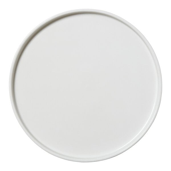 A close-up of a Steelite Performance Taste white plate with a circular rim.