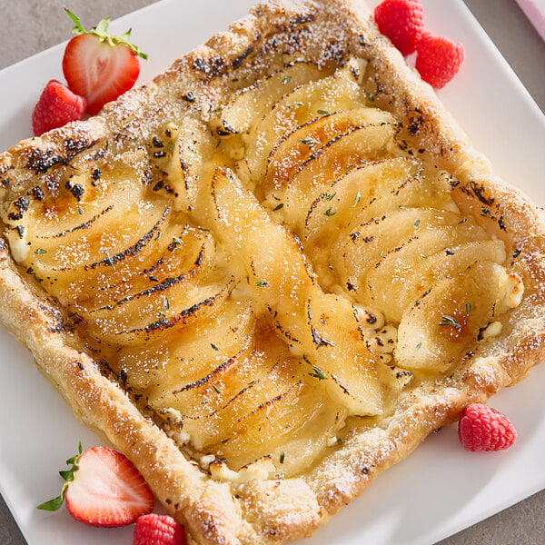 Sliced pears in light syrup on a plate.