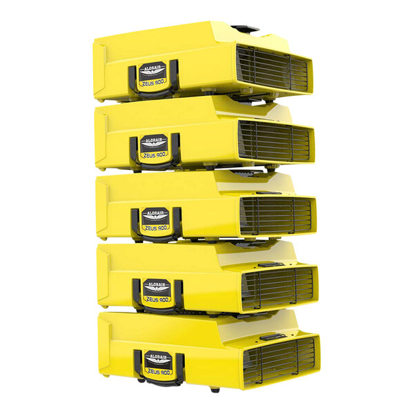 A stack of yellow AlorAir Zeus 900 air movers.