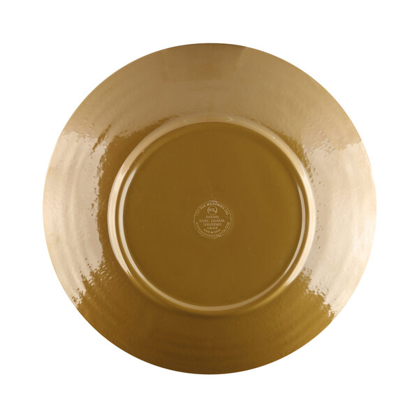 A white plate with a gold logo and brown rim.