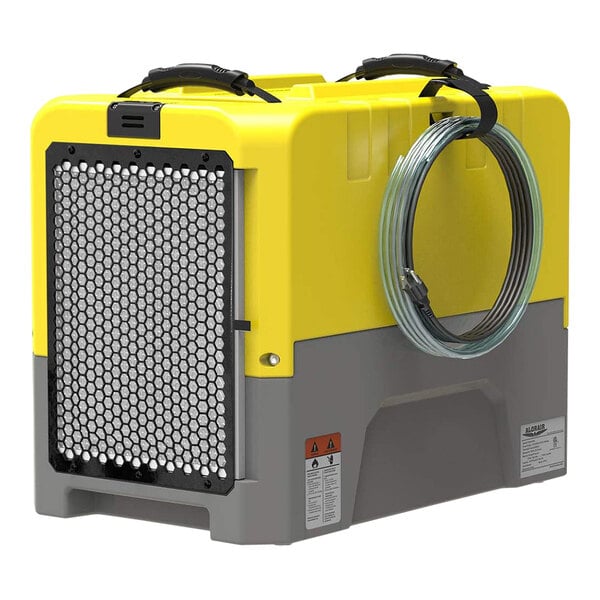 An AlorAir yellow and grey industrial dehumidifier box with a wire wrapped around it.