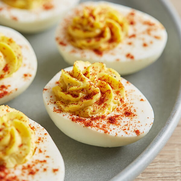 A plate of deviled eggs sprinkled with Badia Paprika.