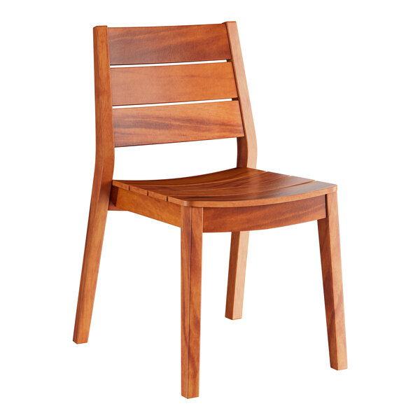 A Lancaster Table & Seating Tigerwood outdoor table with 2 slat back chairs.