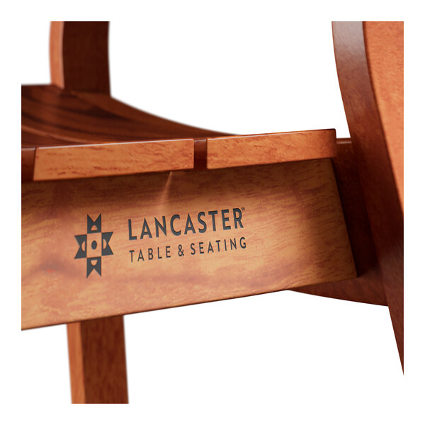 A close-up of the tigerwood slat back on a Lancaster Table & Seating Virelli outdoor side chair.