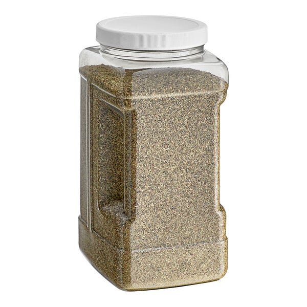 A plastic container of Badia Whole Oregano with a white lid.