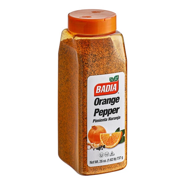 A plastic container of Badia Orange Pepper with orange powder inside.