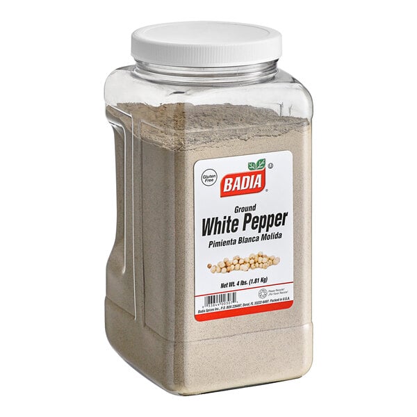 A plastic container of Badia ground white pepper.