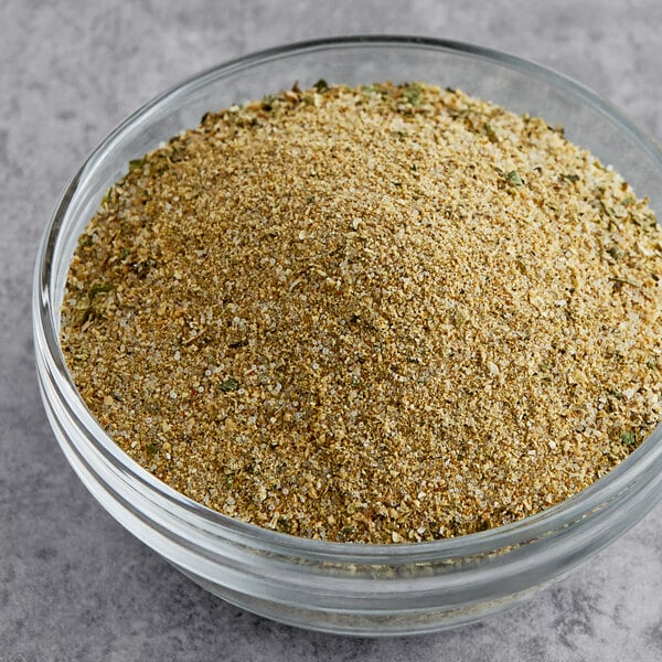 A bowl of Badia Sazon Tropical seasoning.