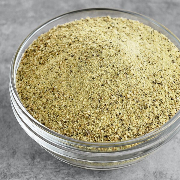 A bowl of Badia Lemon Pepper seasoning.