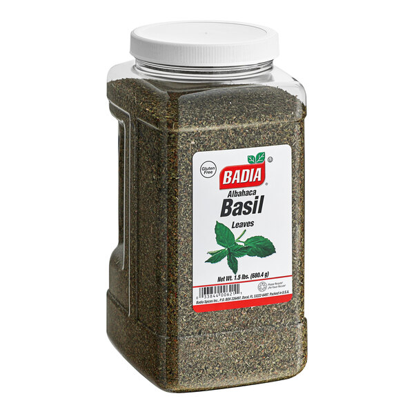 A container of Badia basil leaves with a label on it.