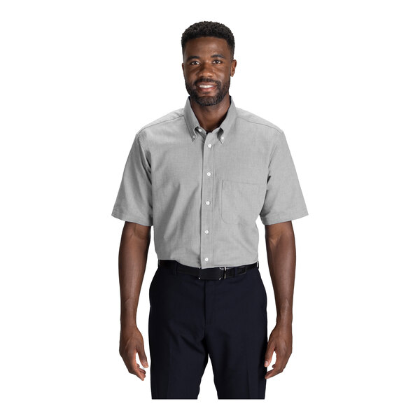 A men's light gray short sleeve oxford dress shirt with a front pocket and button-down collar.