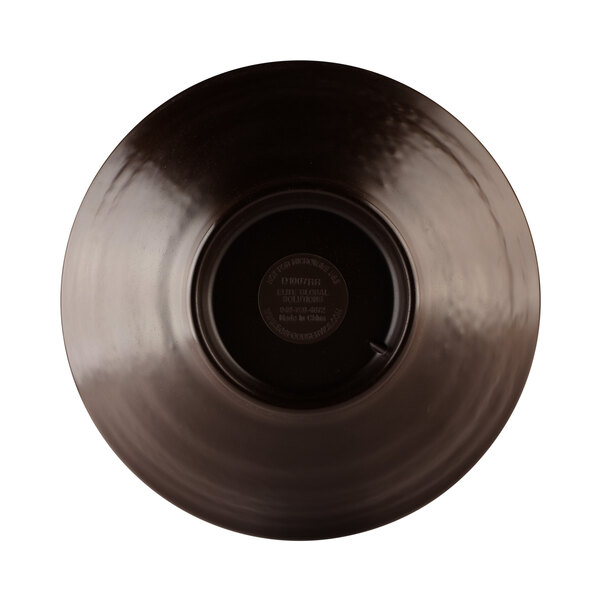 A close-up of an Elite Global Solutions Lizard-Colored melamine bowl with a black rim.