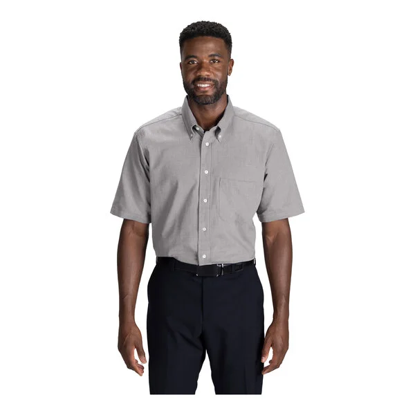 A men's gray short sleeve button-up dress shirt with a front pocket, worn with black pants.