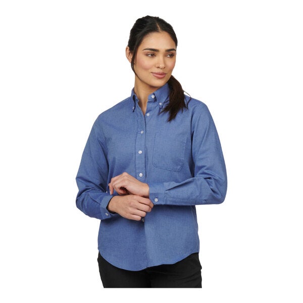 A women's long sleeve French blue oxford dress shirt with a button-down collar and chest pocket.