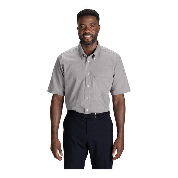 A men's short sleeve gray oxford dress shirt with a front pocket and button-down collar.