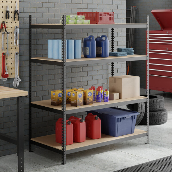 A black heavy-duty four-shelf boltless particle board shelving unit with 72-inch uprights, used for garage or workshop storage.