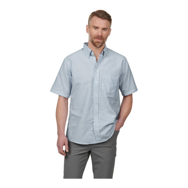 A men's short sleeve blue striped oxford dress shirt with a front pocket and button-down collar.
