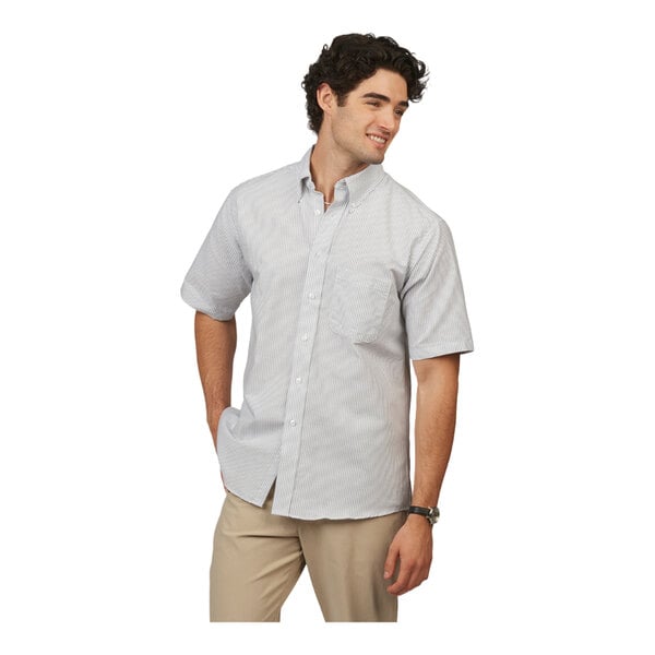 A men's gray stripe short sleeve button-up dress shirt with a front pocket, worn with khaki pants.