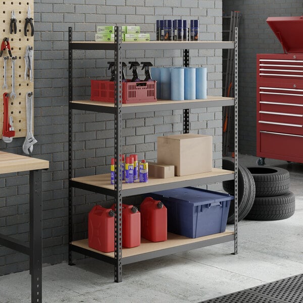 A black heavy-duty beam particle board shelf designed for 4-shelf boltless shelving units, shown in a garage setting with various storage items.
