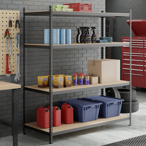 A black heavy-duty 4-shelf boltless shelving unit with particle board shelves and 84-inch uprights, used for garage or storage organization.