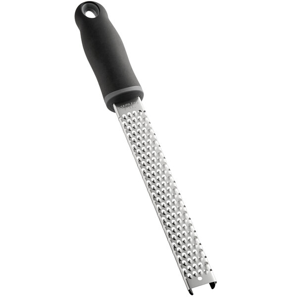 A close-up of a Choice stainless steel handheld grater with a black handle.