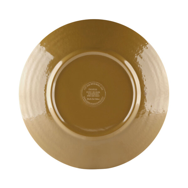 A close-up of an Elite Global Solutions Pebble Creek Tapenade-colored plate with a brown plate and gold rim.