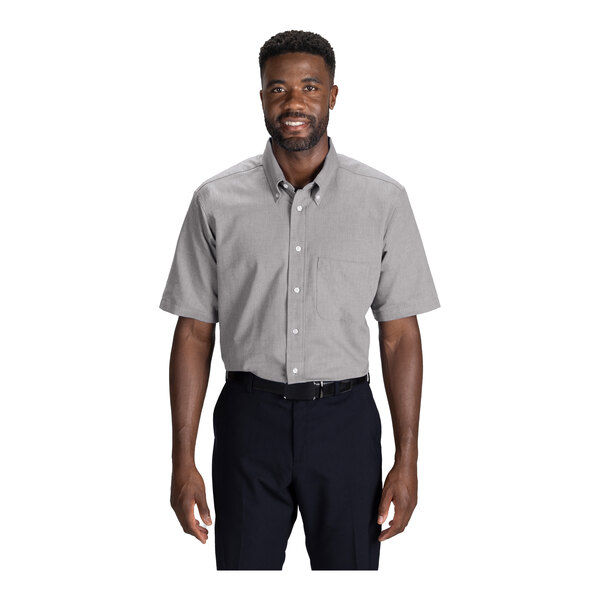 A men's gray short sleeve button-up dress shirt with a front pocket, designed to be wrinkle-resistant and easy-care.