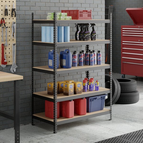 A black heavy-duty five-shelf boltless particle board shelving unit with various automotive and cleaning supplies stored on it.
