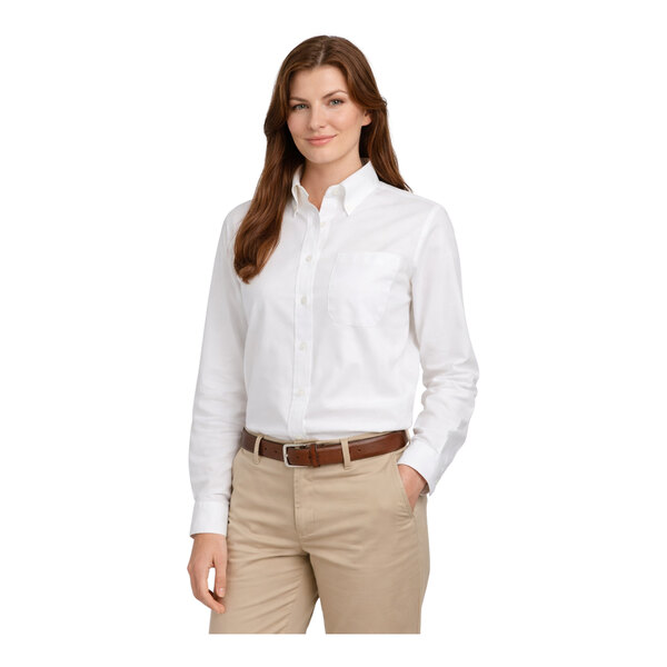 A women's white long sleeve oxford dress shirt with a front pocket, designed to be wrinkle-resistant and easy-care.