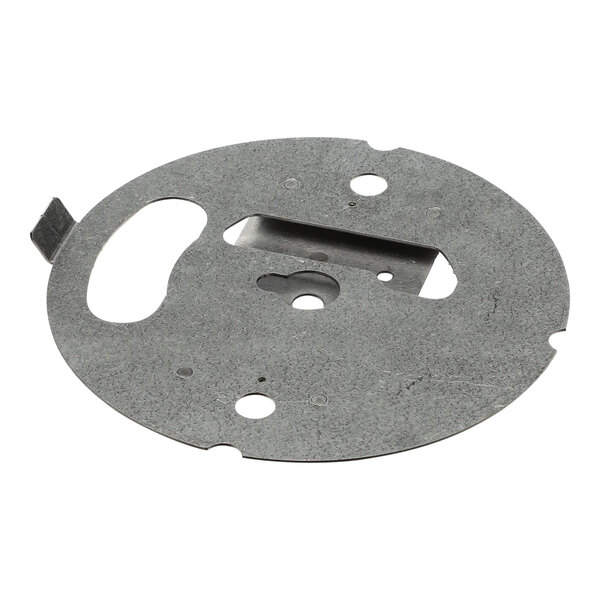 A circular metal plate with holes.
