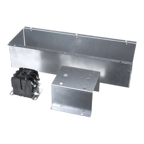 A metal box with black and metal Wells parts inside.