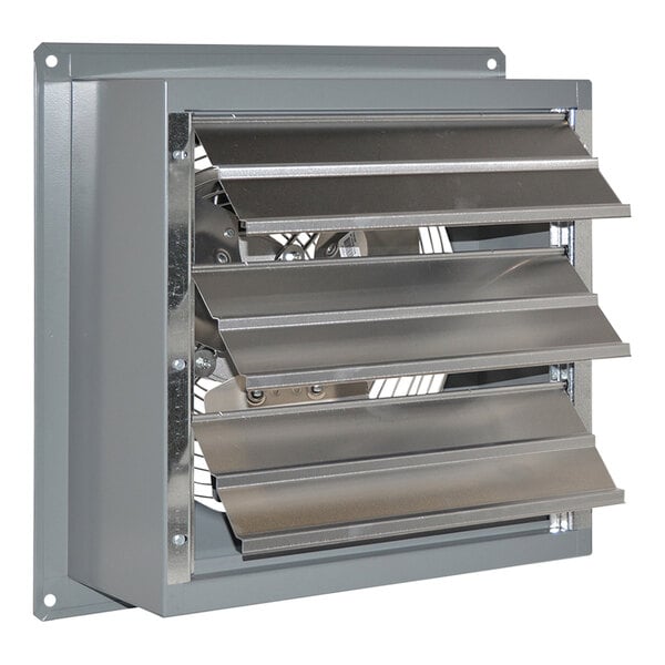 A metal Canarm standard wall exhaust fan with a vent and a fan in the back.