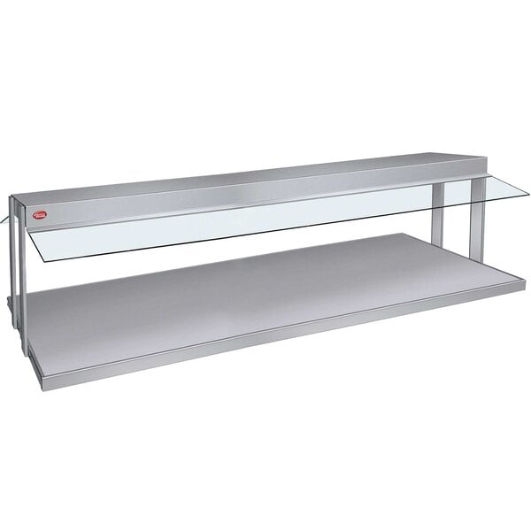 A silver Hatco countertop buffet warmer with a glass top over two shelves.