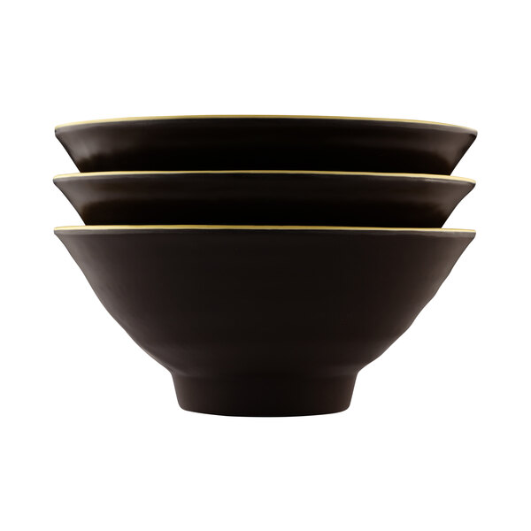Three black Elite Global Solutions bowls with yellow rims stacked on a white background.