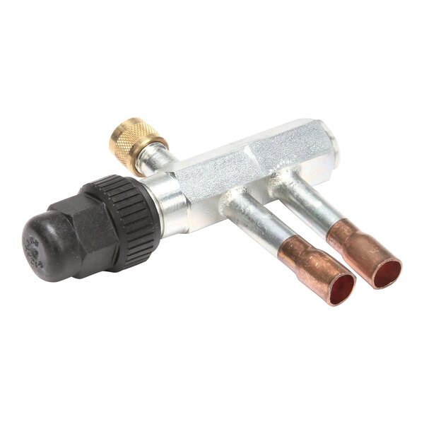 A pair of copper pipe fittings with a Scotsman Valve Access tool.