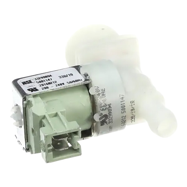 A close up of a white plastic pump with a green cover.