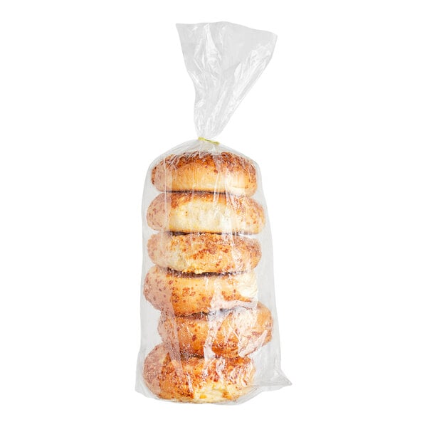 A case of Just Bagels Cheddar Hash Brown Bagels wrapped in plastic.