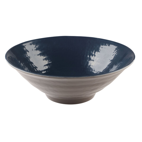 A white melamine bowl with a blue pebble design.