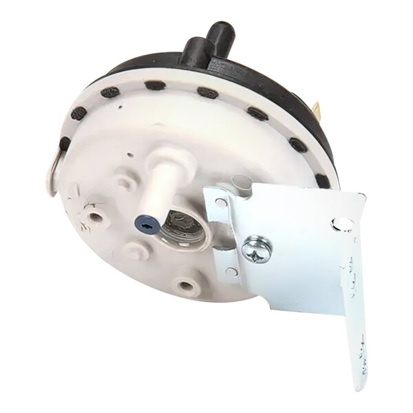 A white and black Wells pressure switch with a metal bracket.