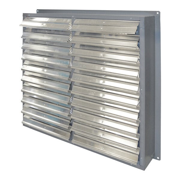 A metal wall-mounted Canarm exhaust fan with a large number of holes.