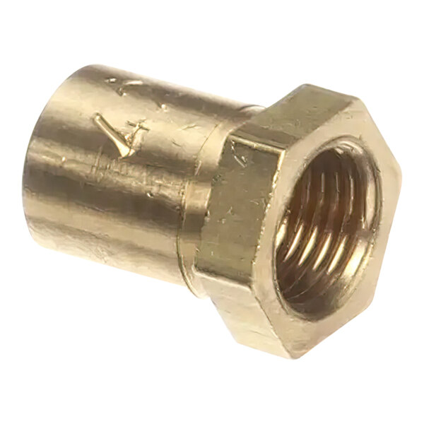 A gold metal Wells orifice-hood nut with a brass nut on it.