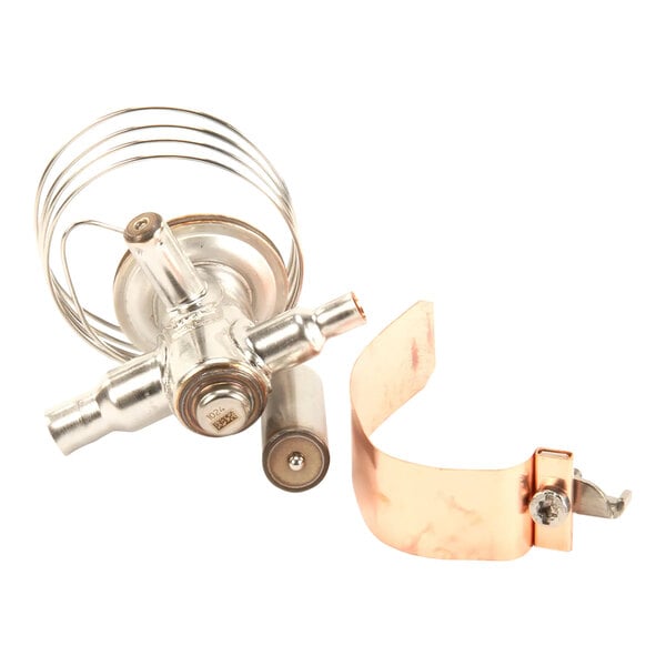A copper and silver metal Scotsman thermostat with a copper pipe.