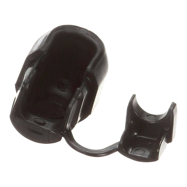 A black plastic Wells bushing with a hole.