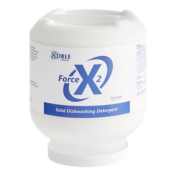 A white container of Noble Chemical Force X2 solid dish machine detergent with blue text.