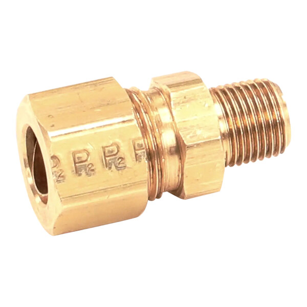 A Wells brass male fitting with threads on one end and a nut on the other.