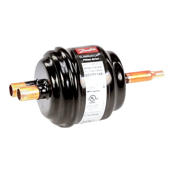 A black Scotsman drier container with copper pipes.