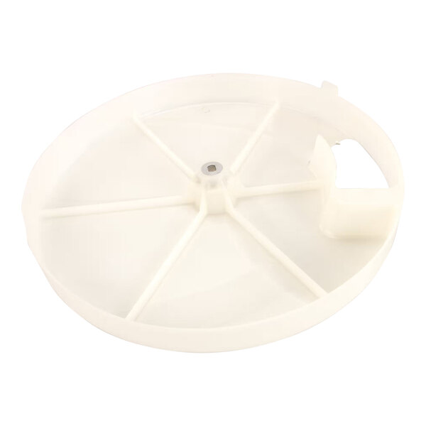 A white plastic disc with a hole in the middle.