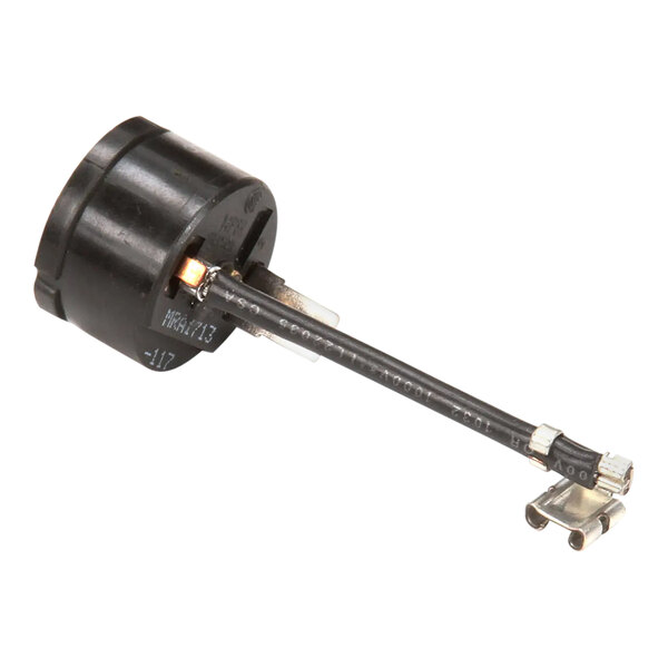 A black round electrical connector for a Scotsman ice machine with metal connectors.