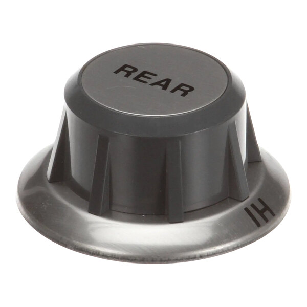 A close-up of a black and silver Wells knob with the word "Rear" on it.