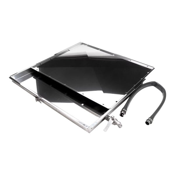 A black and silver rectangular Rational grease collector with a hose attached.